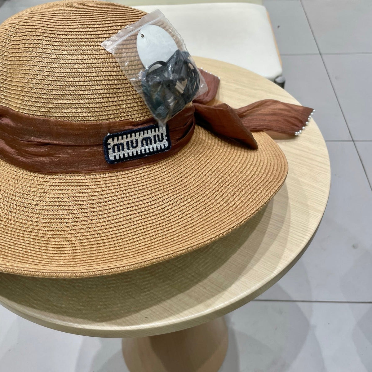 MIU MIU MM WIDE-BRIM BEACH HAT IN BEIGE WITH FABRIC BOW